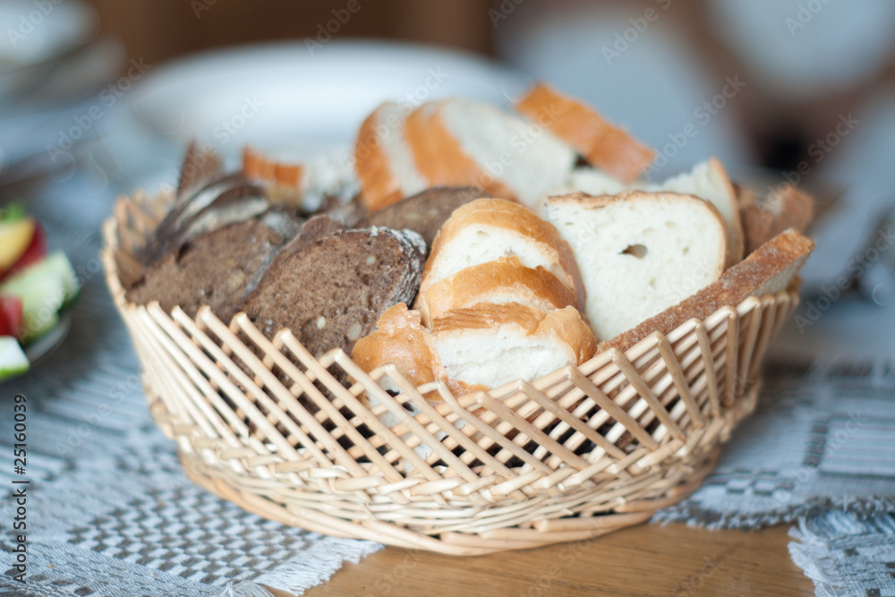 fresh bread in baskte on table
