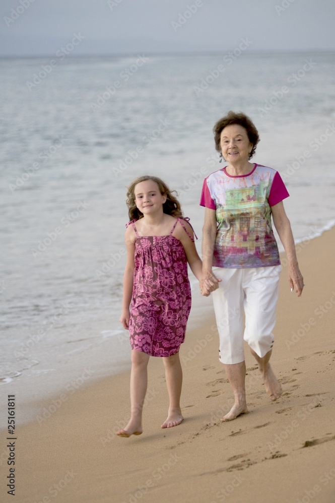 Grandmother And Granddaughter At Seashore, Maui, Hawaii, Usa Grandmother And Granddaughter At Seashore, Maui, Hawaii, Usa