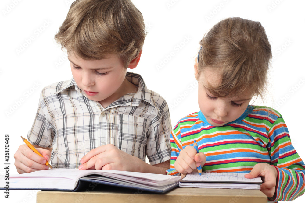 little caucasian boy and girl are painting in notebooks little caucasian boy and girl are painting in notebooks