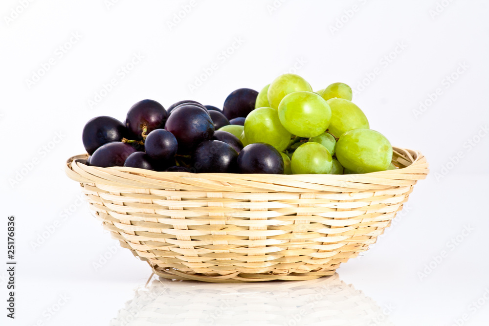 green and blue grapes in a braided dish green and blue grapes in a braided dish