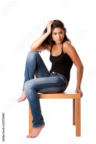 Fashion woman with jeans sitting