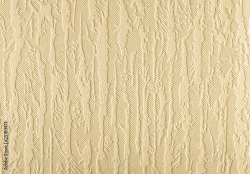 Surface of beige wallpaper having the relief