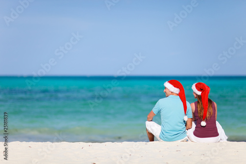 Young couple on Christmas beach vacation