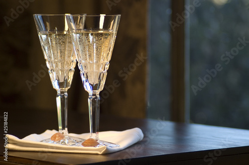Vászonkép Two Waterford Champagne Glasses with Seashells