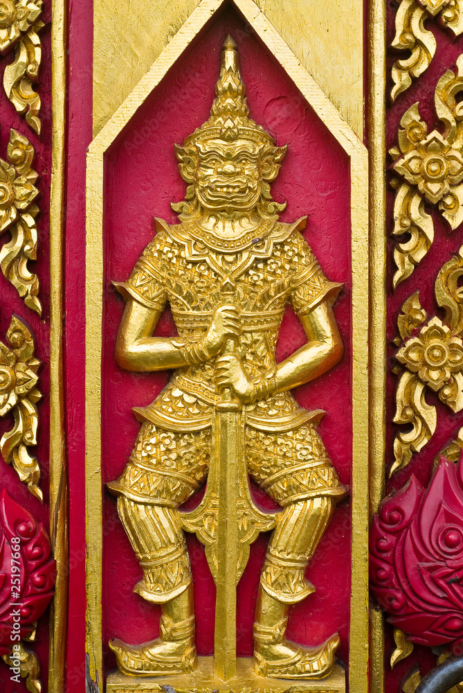 Buddha carved gold paint on church door Buddha carved gold paint on church door