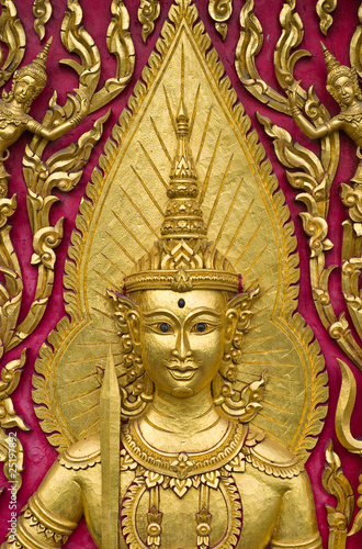 Buddha carved gold paint on church door