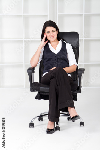 young businesswoman in office chair