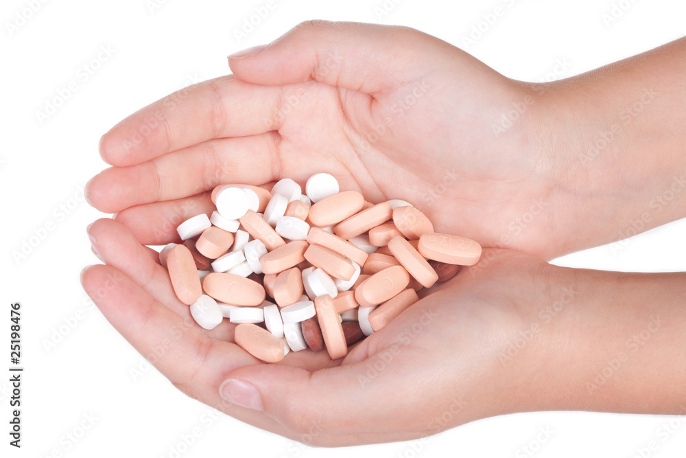 medical pills in a female hand, isolated medical pills in a female hand, isolated