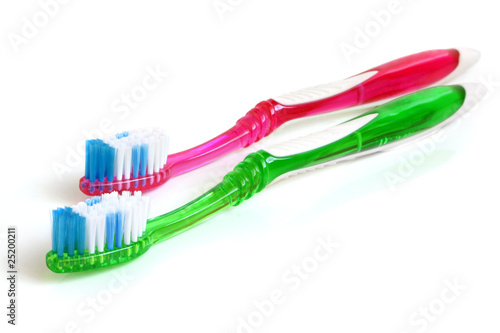 Two colorful tooth-brushes