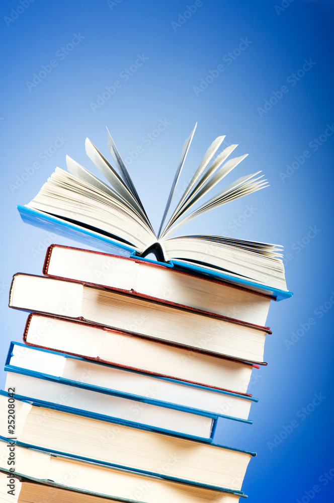 Stack of text books against gradient background Stack of text books against gradient background