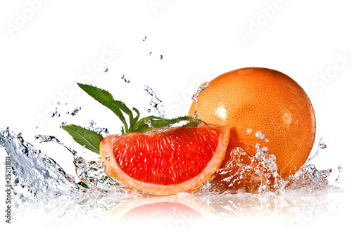 Water splash on grapefruit with mint isolated on white