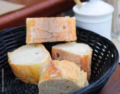 little roll breads in basket on table