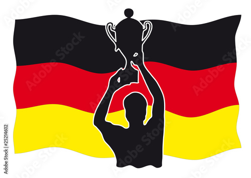 Sieger mit Pokal vor deutscher Flagge