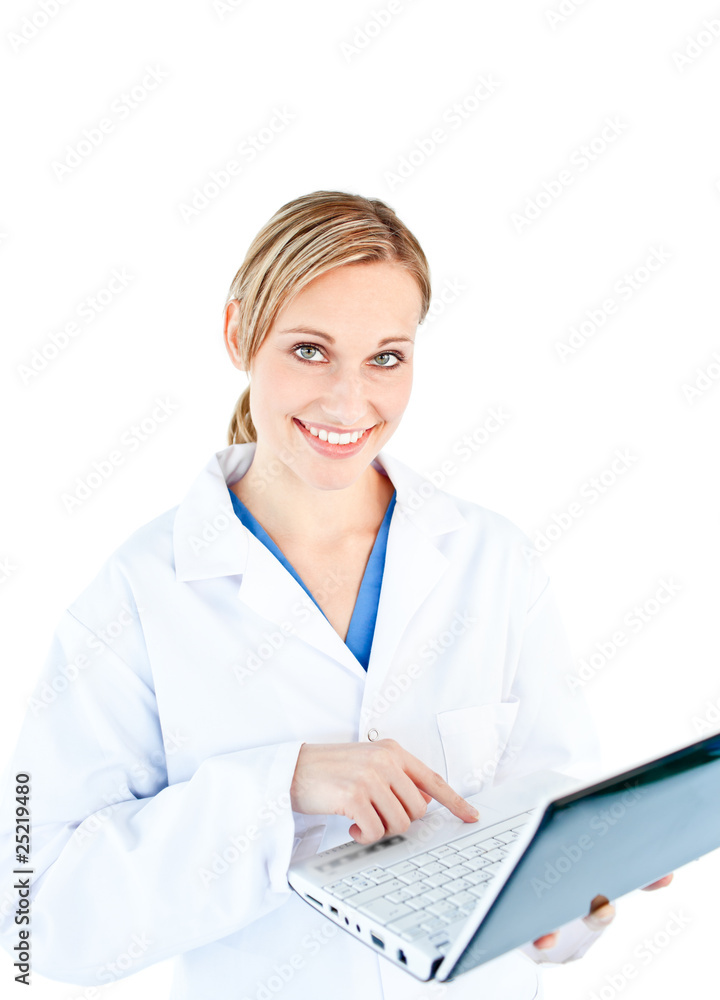 Charming female doctor holding a laptop looking at the camera Charming female doctor holding a laptop looking at the camera