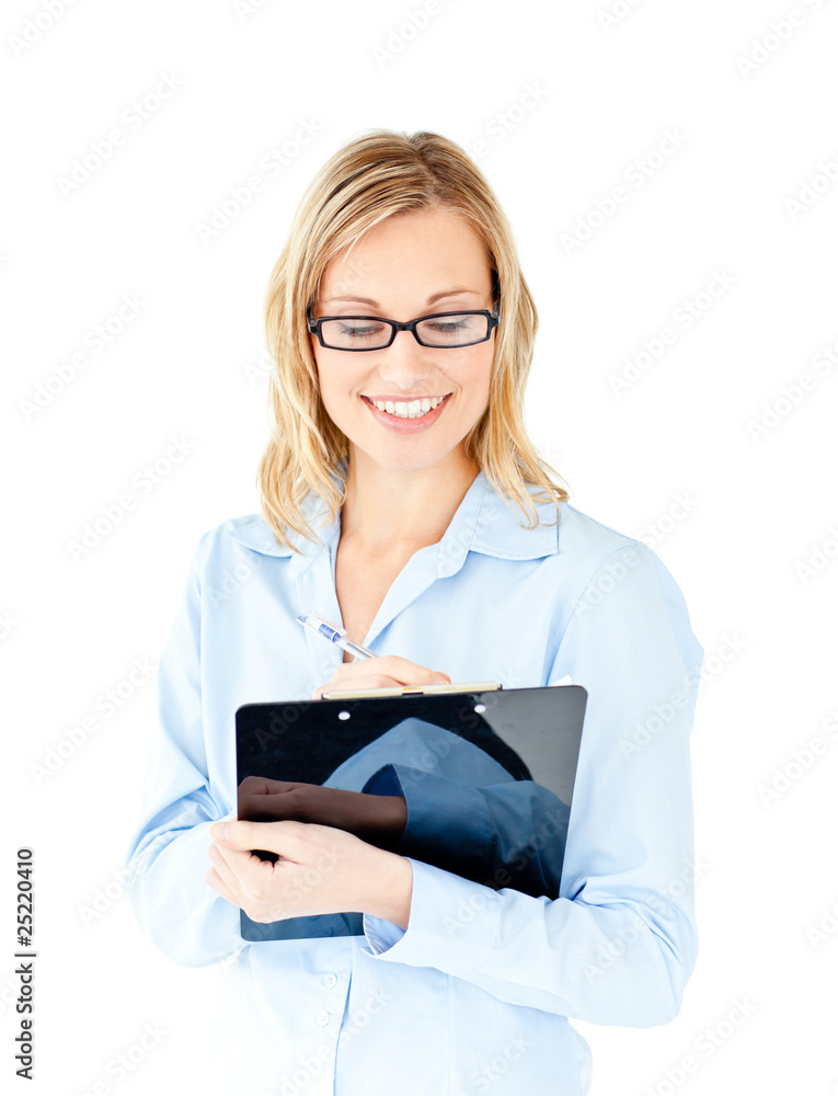 Confident businesswoman taking notes on a clipboard Confident businesswoman taking notes on a clipboard