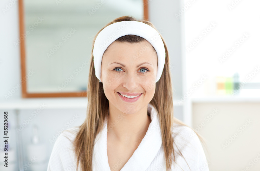 Charming young woman smiling at the camera in the bathroom Charming young woman smiling at the camera in the bathroom