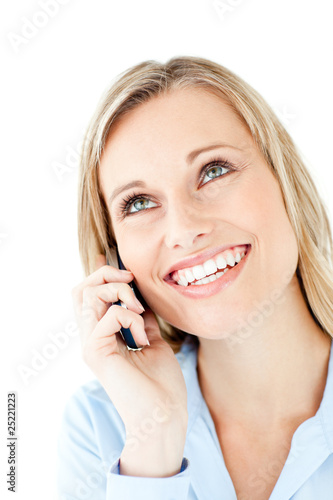 Radiant young businesswoman talking on phone