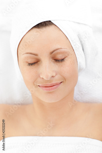 Portrait of a relaxed woman lying on a massage table