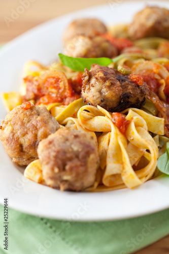 Pappardelle pasta with tomato sauce and meatballs
