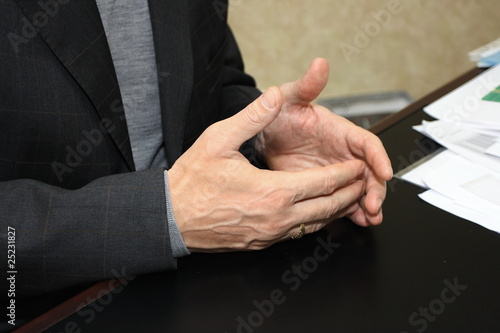 Gesticulating hands of a businessman giving an interview