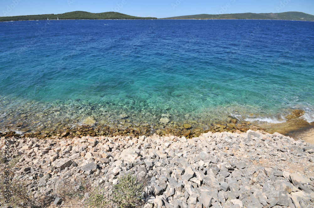 Beauriful clear blue sea water on rocks