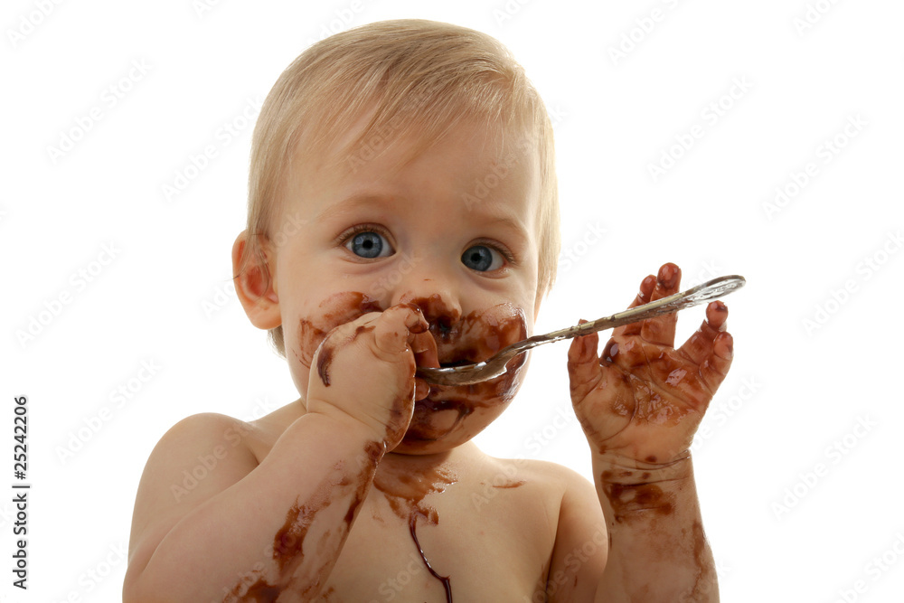 bébé gourmand, en train de manger du chocolat Stock Photo | Adobe Stock