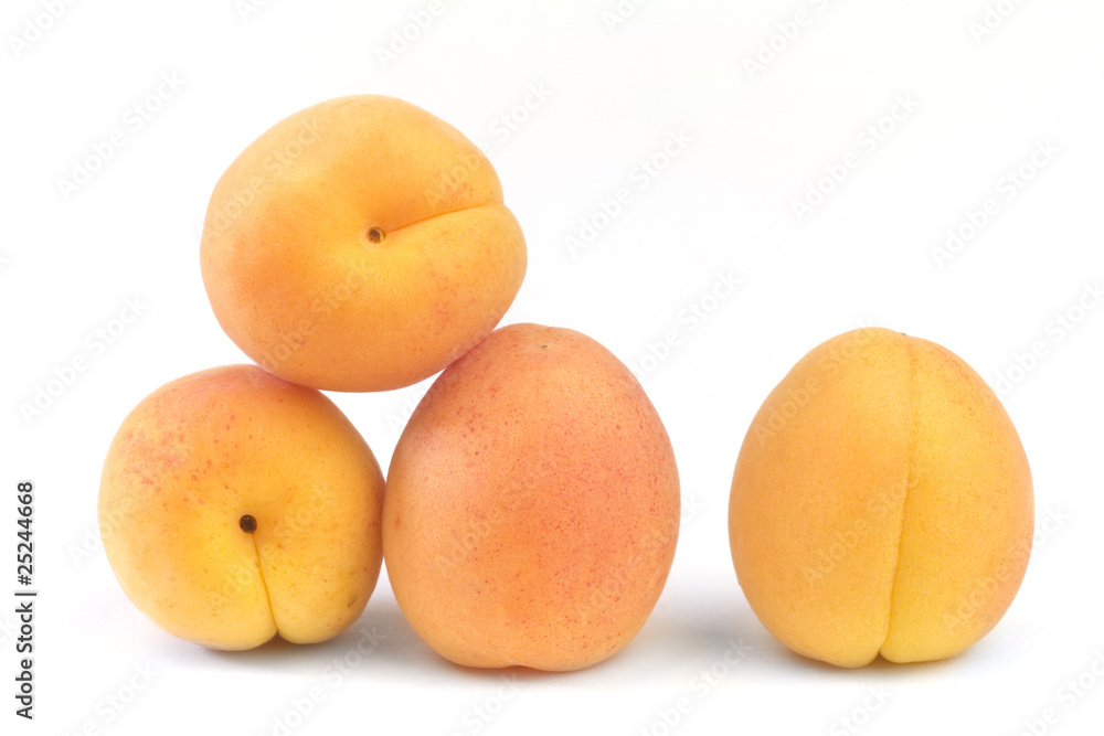 Four ripe apricots isolated on white background Four ripe apricots isolated on white background