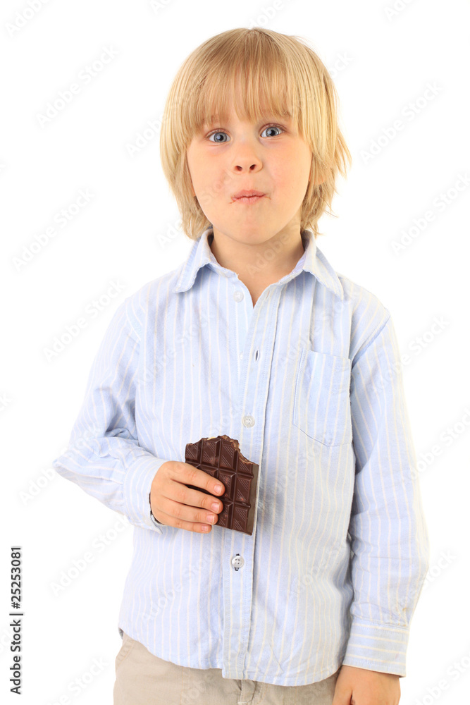 happy little boy eating chocolate isolated on white happy little boy eating chocolate isolated on white