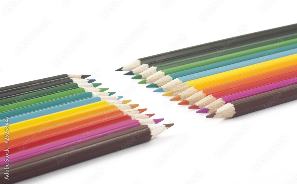Wooden pencils of different colors on a white background Wooden pencils of different colors on a white background