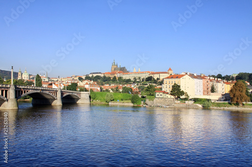 View on summer Prague above River Vltava with gothic Castle