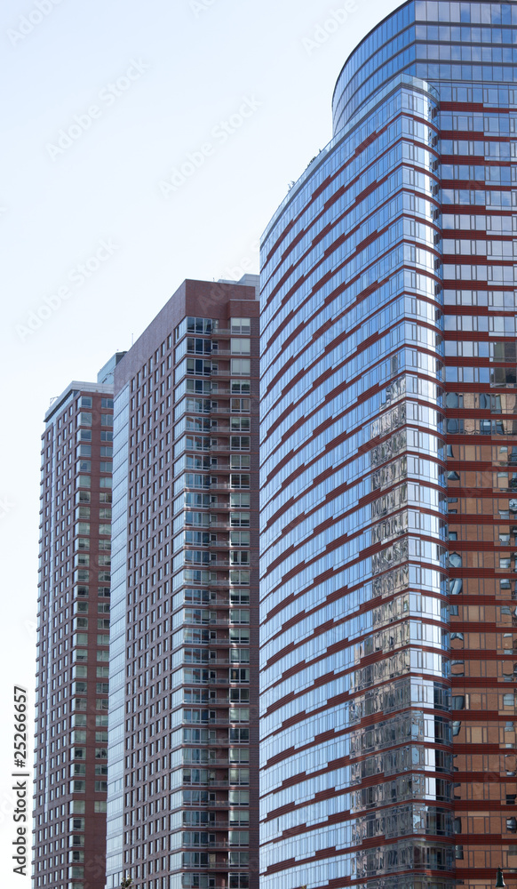 facade of modern apartment building with reflection of blue sky facade of modern apartment building with reflection of blue sky