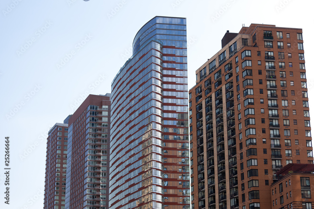 facade of modern apartment building with reflection of blue sky facade of modern apartment building with reflection of blue sky