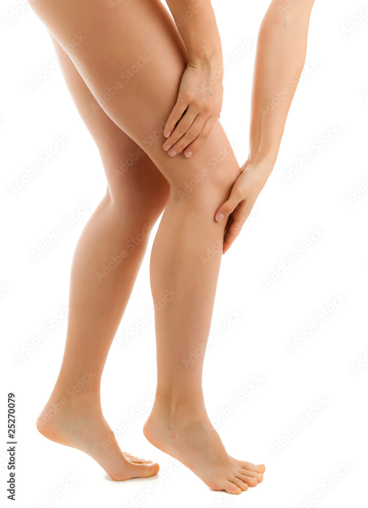Woman massaging pain knee on white background Woman massaging pain knee on white background