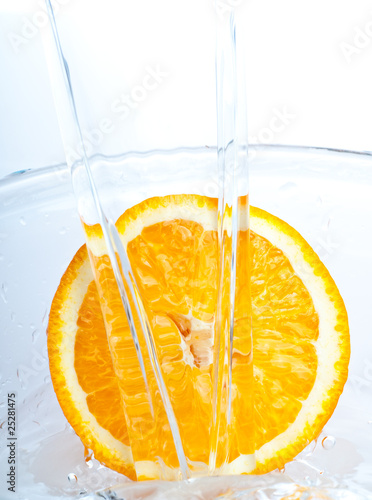 orange into water splash