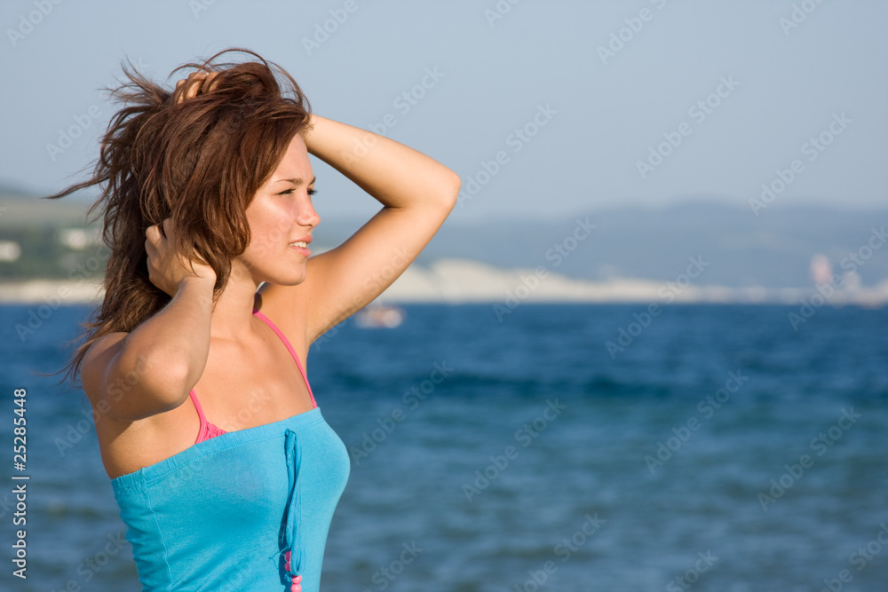 A young girl on the background of the sea A young girl on the background of the sea