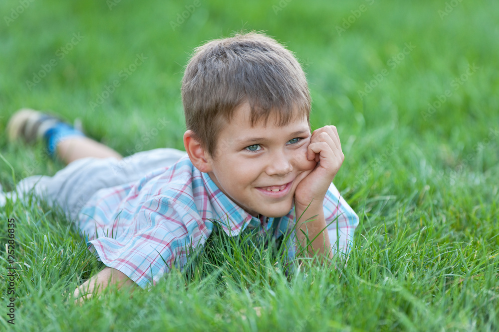 Handsome boy on the green grass Handsome boy on the green grass