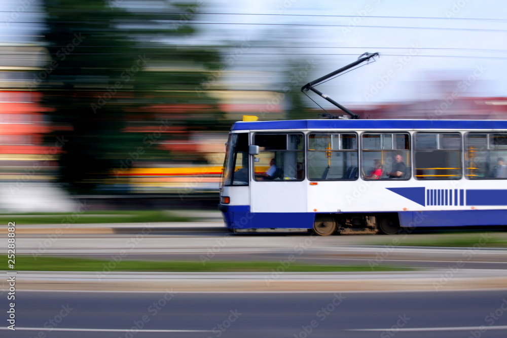 Old blue tram rider fast on rails, Wroclaw, Poland