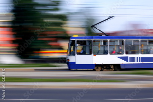 Old blue tram rider fast on rails, Wroclaw, Poland
