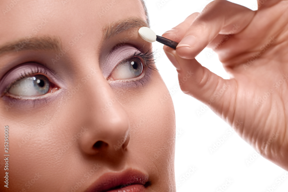 Woman applying eye shadow