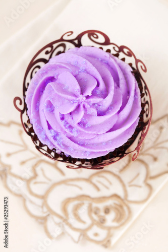 cupcake with lavender top in festive wrap on beige