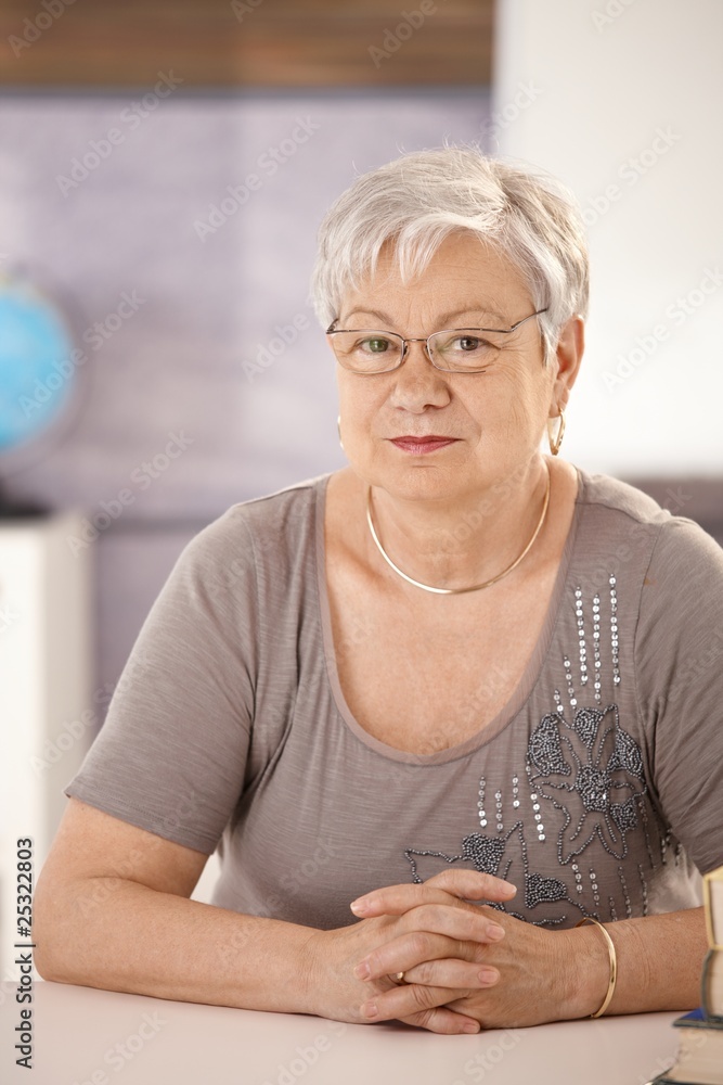 Portrait of senior teacher in classroom Portrait of senior teacher in classroom