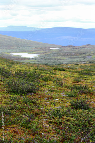 mountain lakes with blue hills in the back