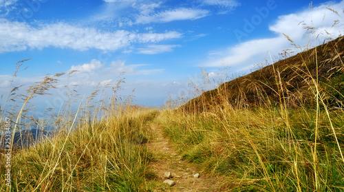 Mountain pathway to blue sky