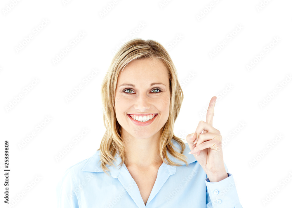 Smiling businesswoman pointing upwards with her finger Smiling businesswoman pointing upwards with her finger