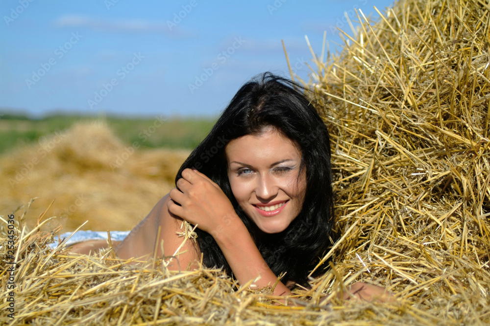 Portrait of the girl against haystacks Portrait of the girl against haystacks