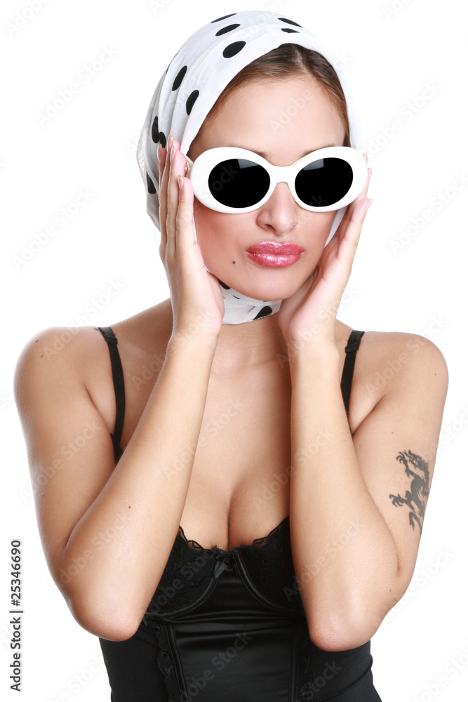Naklejka premium Portrait of the beautiful girl in sunglasses