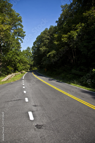 scenic country road curves through Shenandoah National Park.