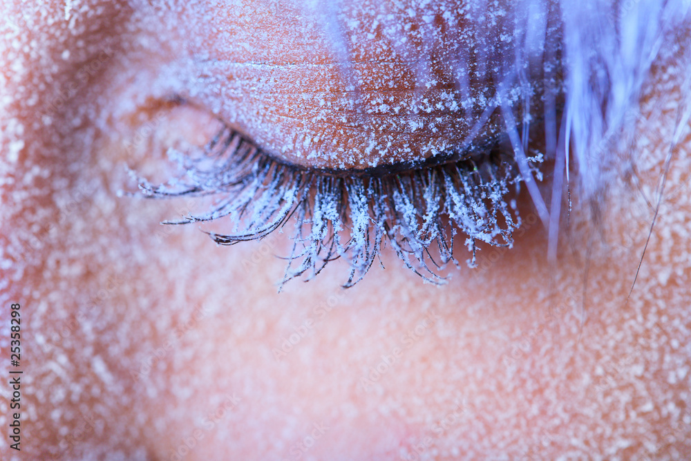 Fototapeta premium Frozen woman's eye covered in frost