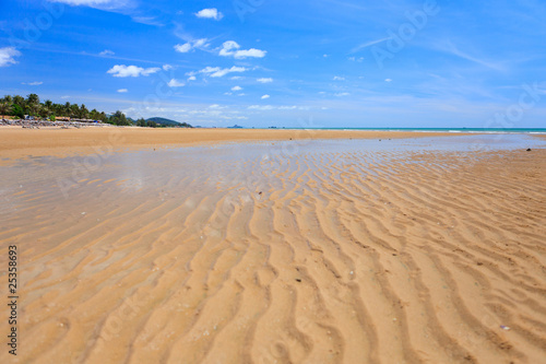 Low tide on golden sand beach