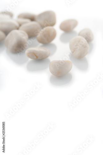 White stones on white background focused